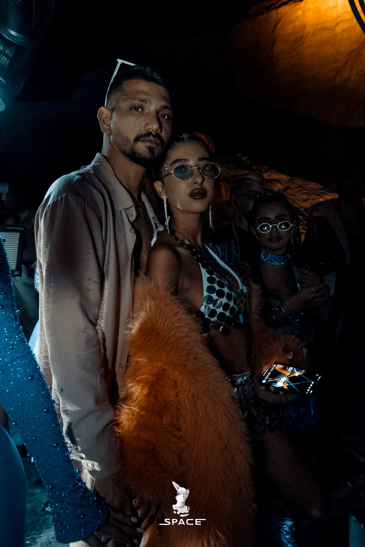 Two people at a SPACE night event, warm canyon light behind them